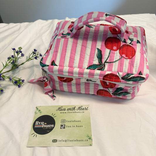 Pink and white striped pillowcase with cherry design on a white pillow, branded 'Made with Heart'.