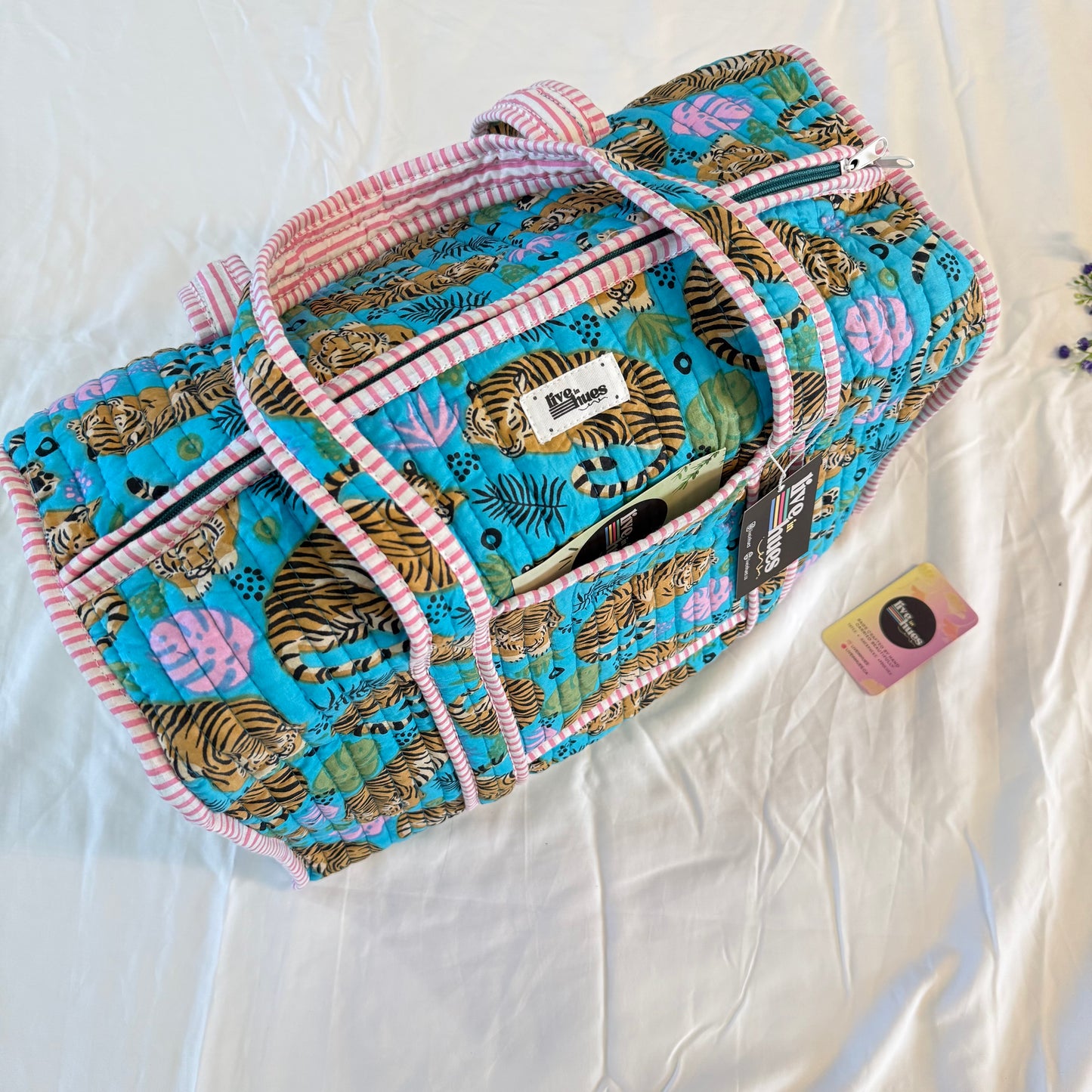 Quilted bag with tiger pattern on a white background