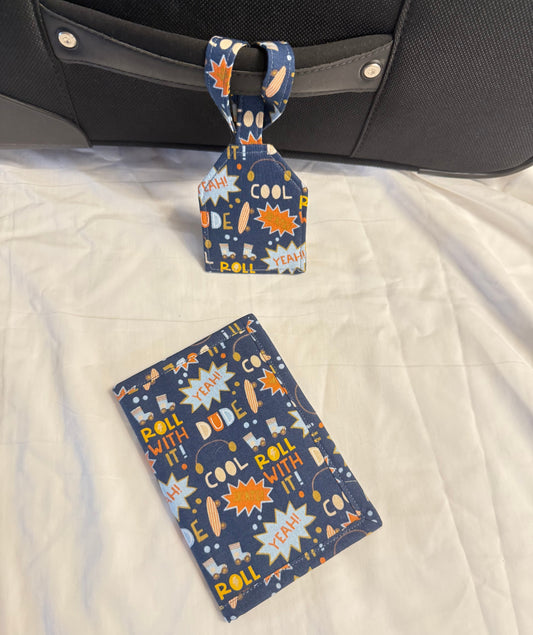 Luggage tag and card with space-themed design on a suitcase.