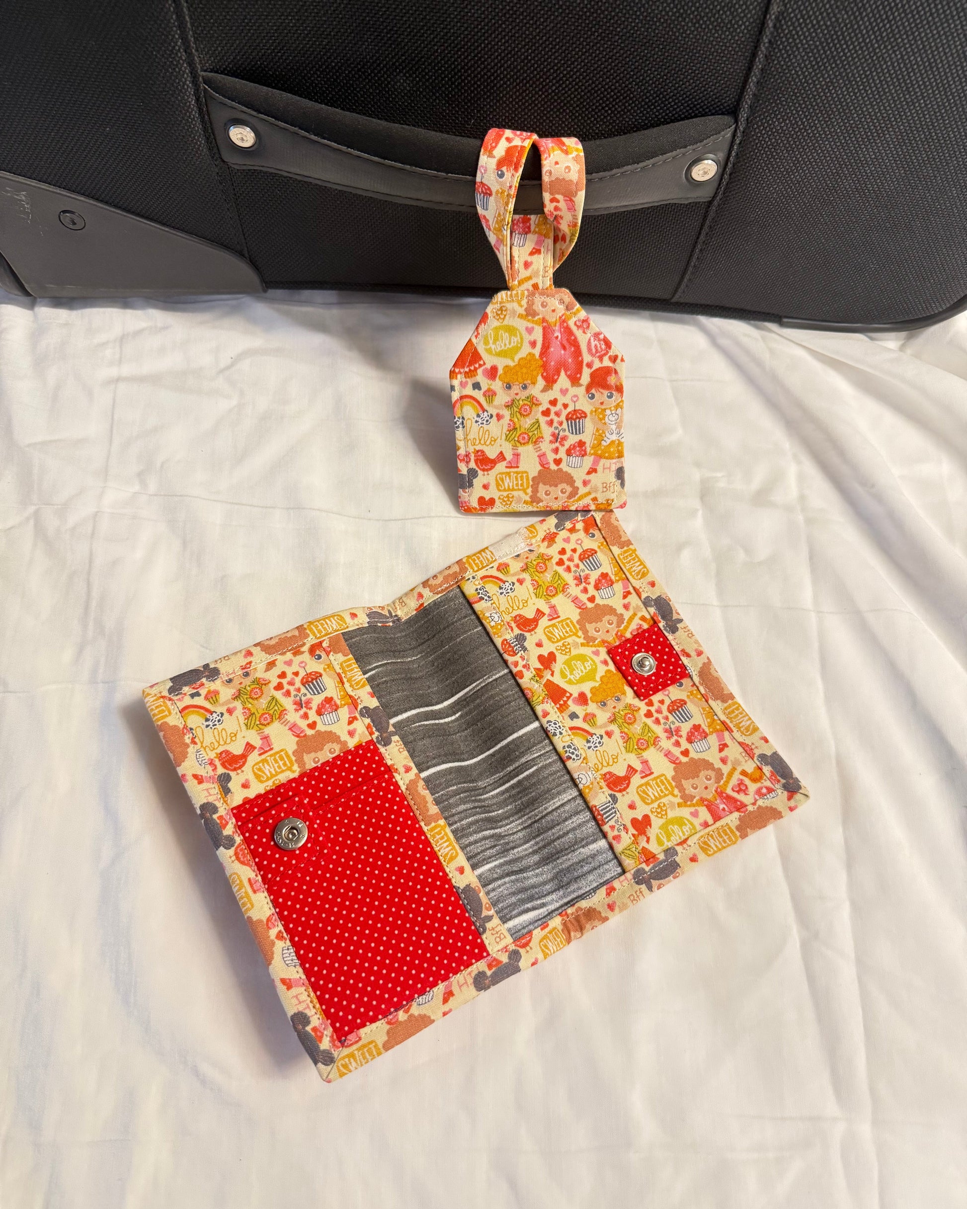 Floral patterned wallet with a red pocket on a white surface