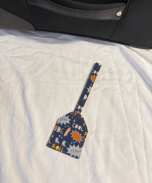 Patterned spatula on a white quilted surface