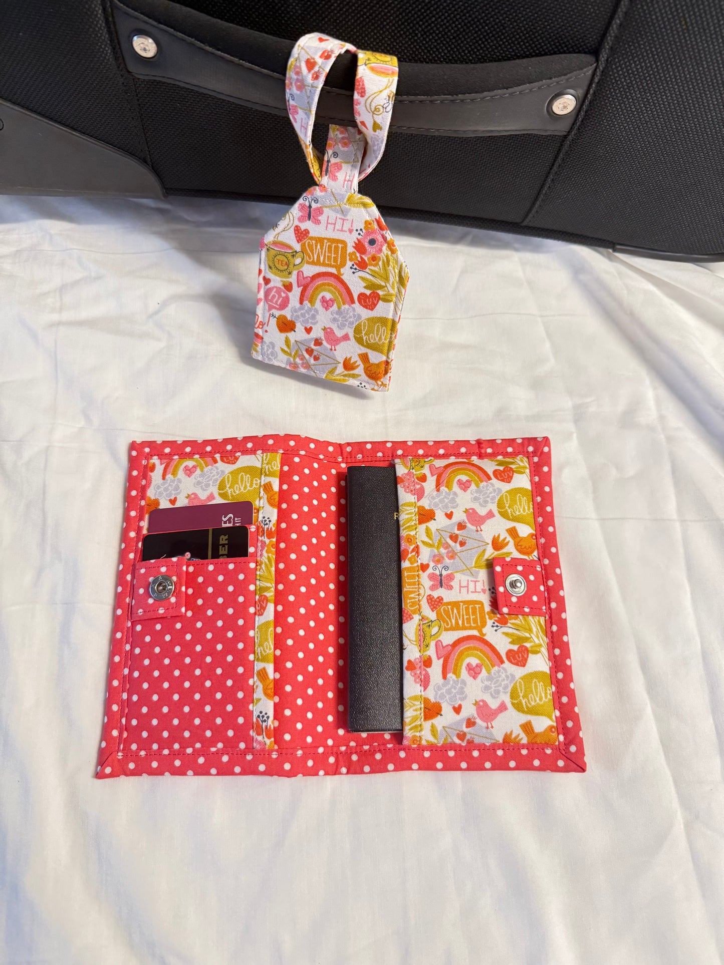 Floral-patterned car organizer attached to a car seat with a white blanket underneath