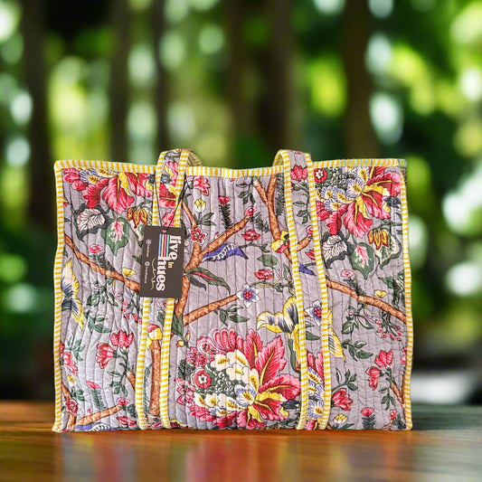 Floral-patterned bag with brand label on a plain background