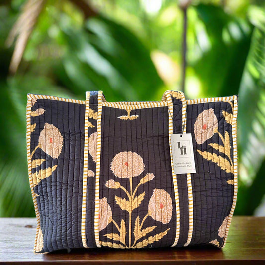 Floral-patterned bag with a visible brand tag on a neutral background