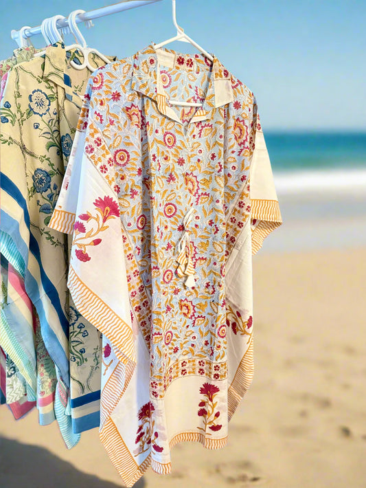 Floral patterned shirt on a rack with a plain background
