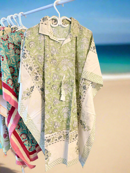 Collection of patterned shirts on a rack with a white background