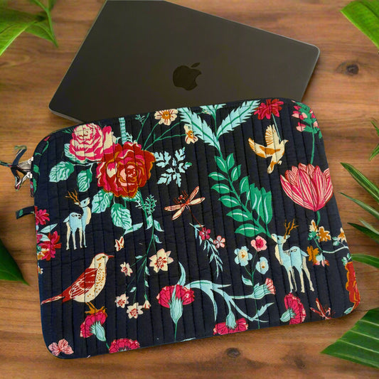 Floral patterned pouch on a white surface with a black item next to it