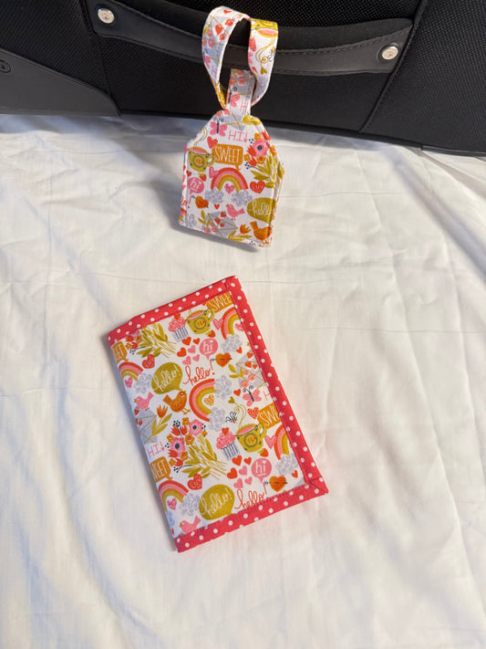 Fabric pouch with floral design on a white quilted surface