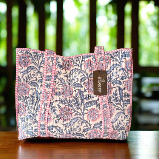 Floral patterned pouch with a brand label on a gray background